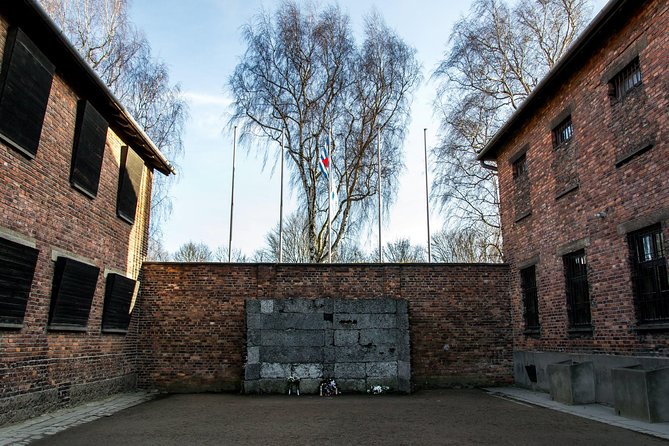 Auschwitz Birkenau Guided Tour Small Group with Hotel Pick up - Entering Auschwitz I with a licensed museum guide