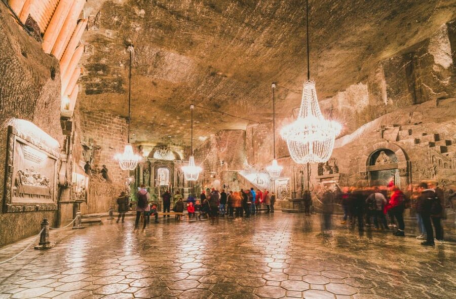 From Krakow: Wieliczka Salt Mine Guided Tour & Pickup Option - Chambers, lakes, and salt-carved art