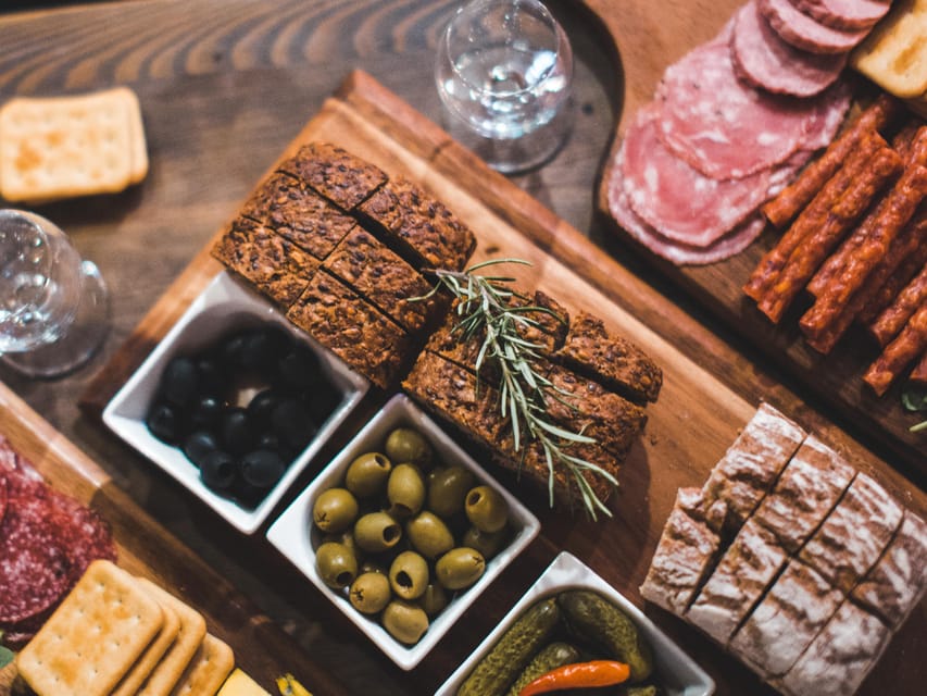 Kraków: Guided Vodka Tour with Food and Drink Tastings - Seven pours, from clear vodka to hot cherry flavors