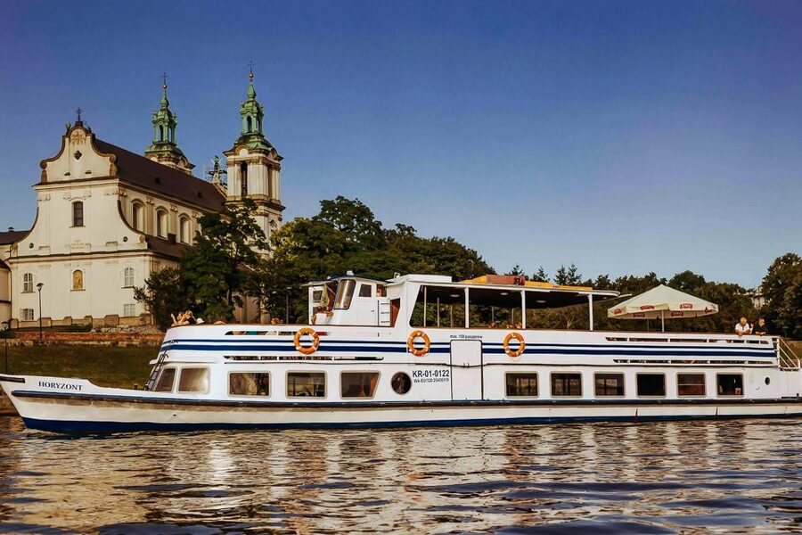 Krakow: Sightseeing Cruise by Vistula River - The open deck, seating, and weather
