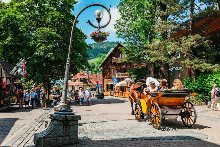 Krakow: Zakopane Tour with Thermal Baths, Cable Car & Pickup - Zakopane, Krupówki Street, and the mountain view