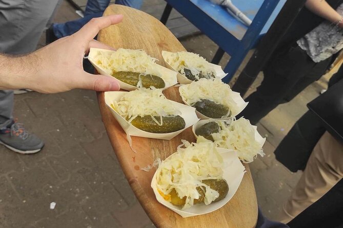 Walking Guided Tour with Street Food in Krakow - Regional cheese, sausage, and pickles